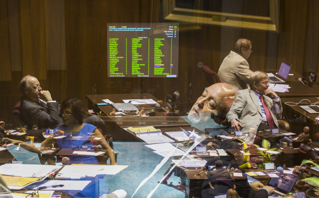 Rep. Macario Saldate leans back and closes his eyes as bills continue being discussed on the House floor on the last day of their session at the State Capitol in Phoenix, AZ on April 2, 2015.  THIS IS A COMPOSITE IMAGE MADE IN-CAMERA FROM THREE EXPOSURES.