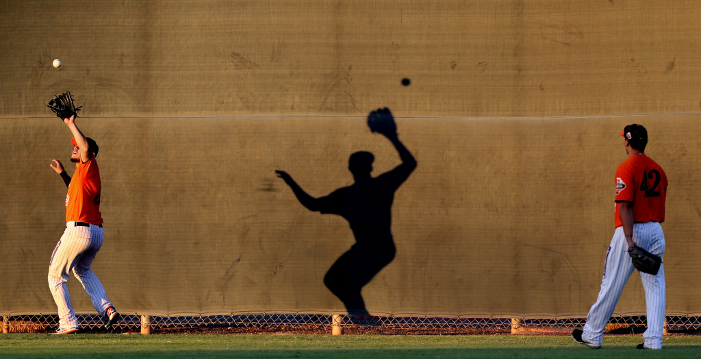 Hermosillo outfielders practice tracking down fly balls near the centerfield fence, working out at Reid Park on the Hi Corbett practice fields as they get ready for this weekend's Mexican Baseball Fiesta, Tuesday Sept. 29, 2015, Tucson, Ariz.  Kelly Presnell / Arizona Daily Star