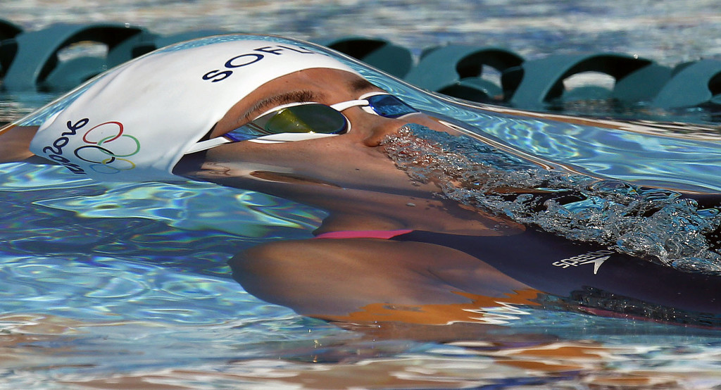 Carolina Colorado swims in the Women's 100 meter backstroke prelims Friday, April 17, 2015, during the Arena Pro Swim Series at the Skyline Aquatic Center.
